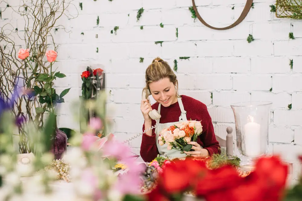 woman-speaking-phone-floral-shop