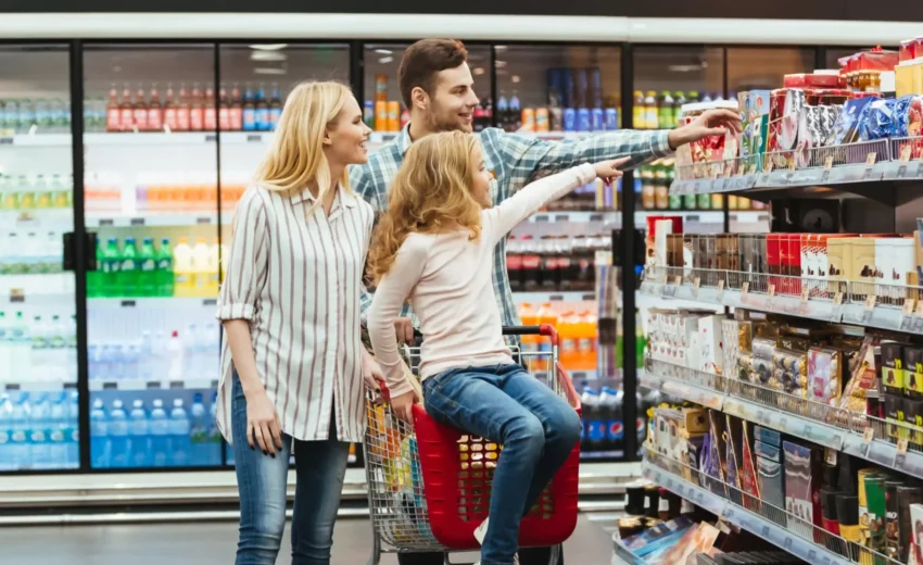 cheery-little-girl-sitting-shopping-cart-1-scaled-e1665739572358